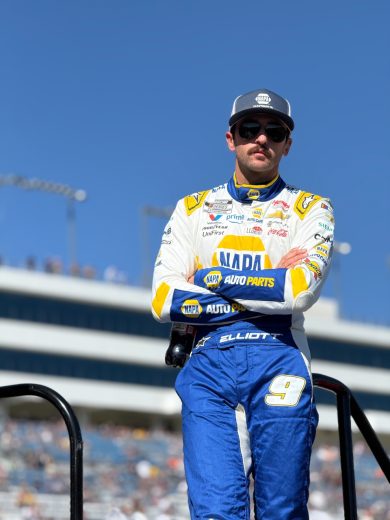 Chase Elliott looks on.