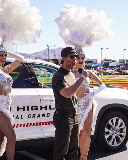 Glenn Powell gives the command at Las Vegas Motor Speedway.