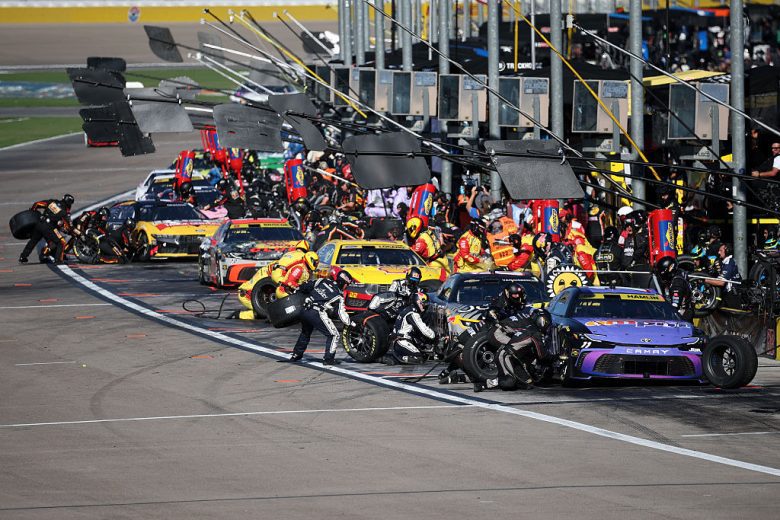 NASCAR Cup Series cars get tended to on pit road at Las Vegas Motor Speedway.
