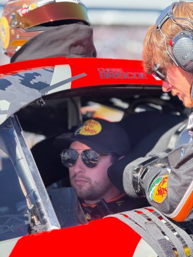 Chase Briscoe sits in his car.