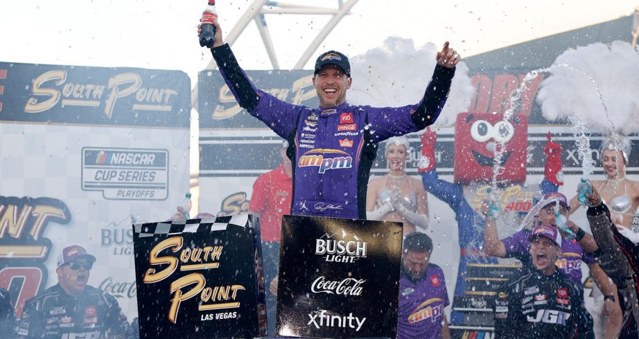 Denny Hamlin celebrates in Victory Lane at Las Vegas Motor Speedway.