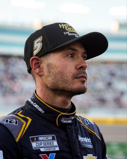 Kyle Larson looks on.