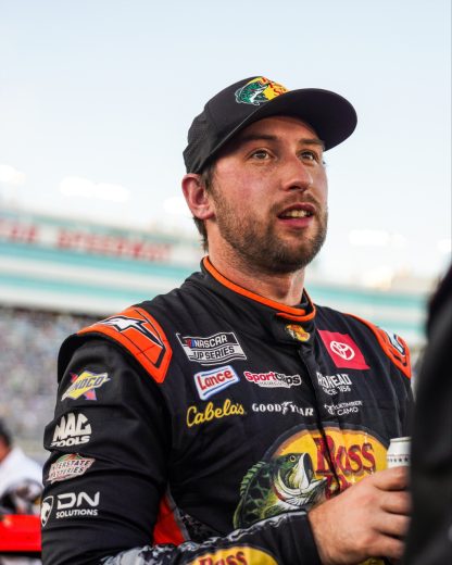Chase Briscoe looks on.