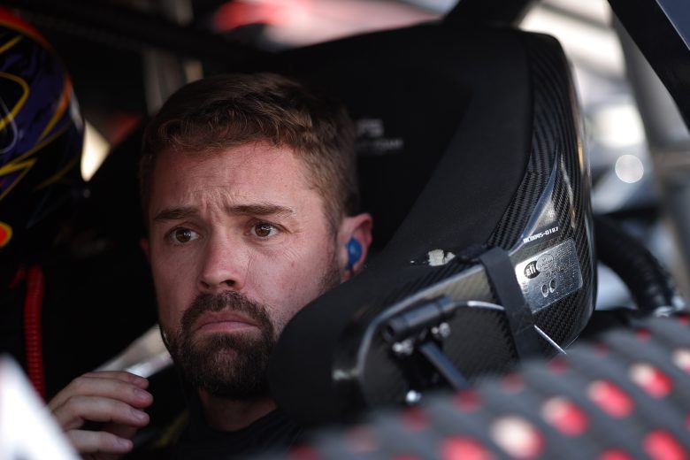 Ricky Stenhouse Jr. looks on.