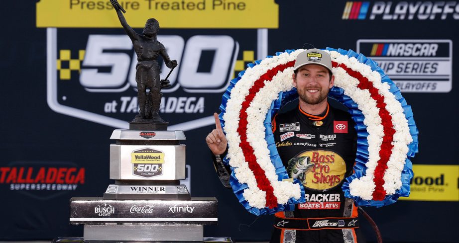 Chase Briscoe stands in Victory Lane at Talladega Superspeedway.