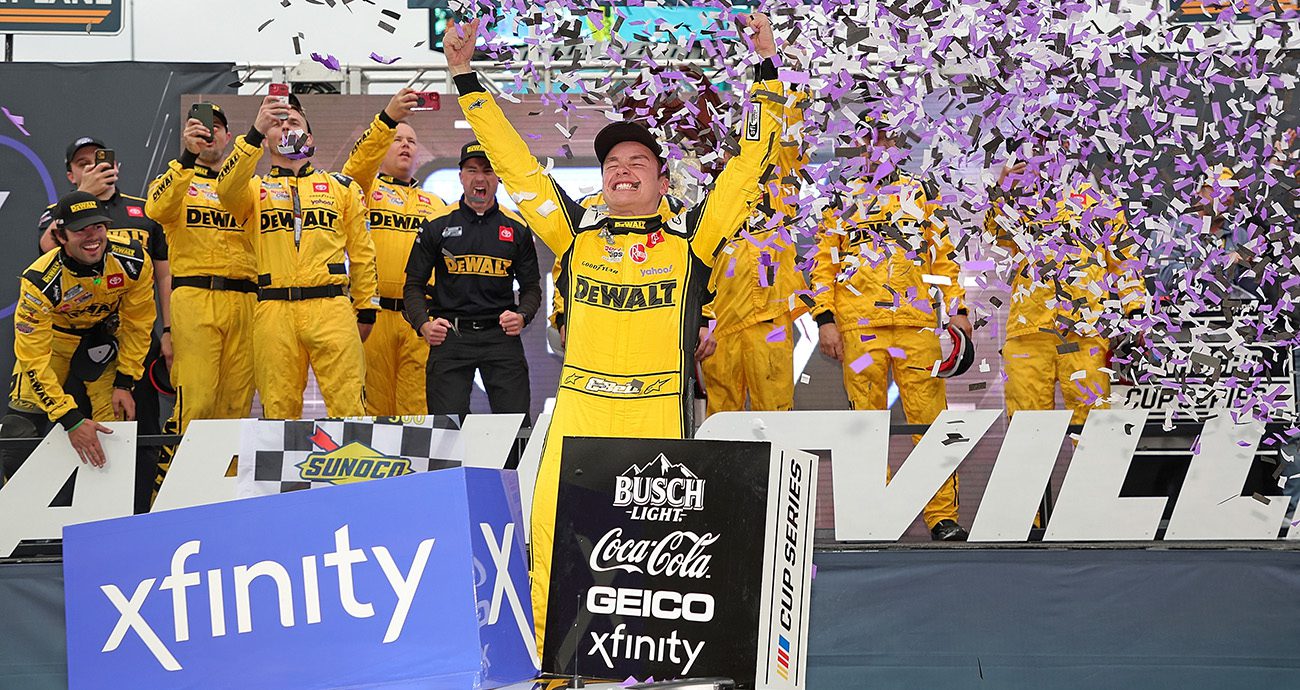 MARTINSVILLE, VIRGINIA - OCTOBER 30: Christopher Bell, driver of the #20 DeWalt Toyota, celebrates in victory lane after winning the NASCAR Cup Series Xfinity 500 at Martinsville Speedway on October 30, 2022 in Martinsville, Virginia.