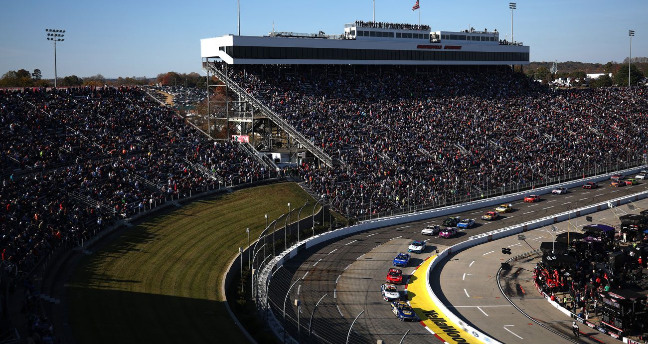 NASCAR Cup Series cars race at Martinsville Speedway.