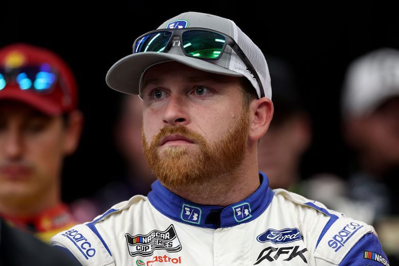 Chris Buescher looks on.