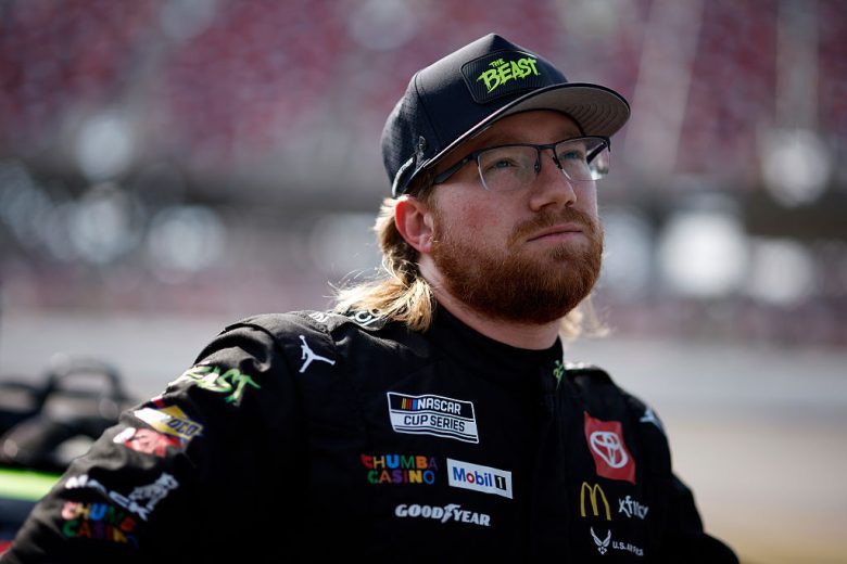 Tyler Reddick looks on.