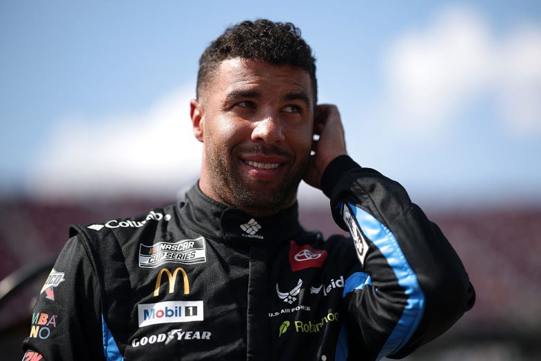 Bubba Wallace looks on.