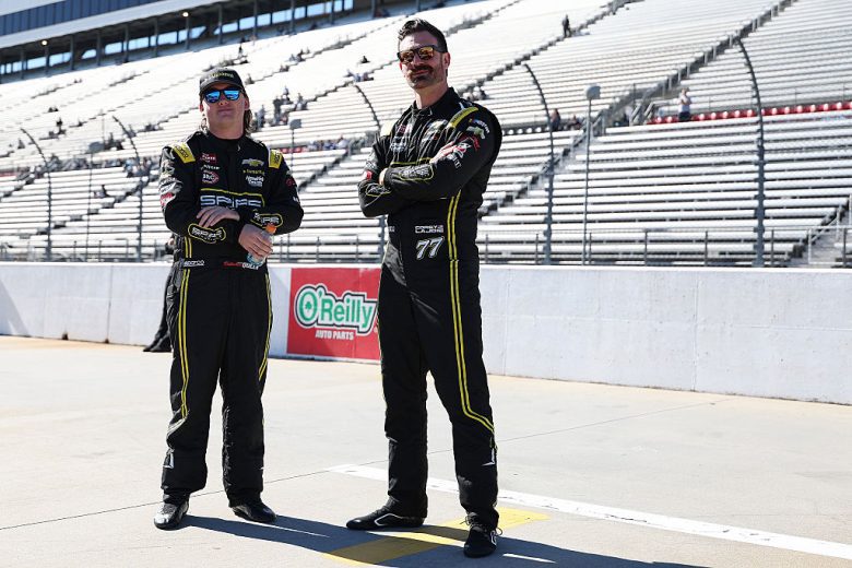 Brenden Queen and Corey LaJoie look on at Martinsville.