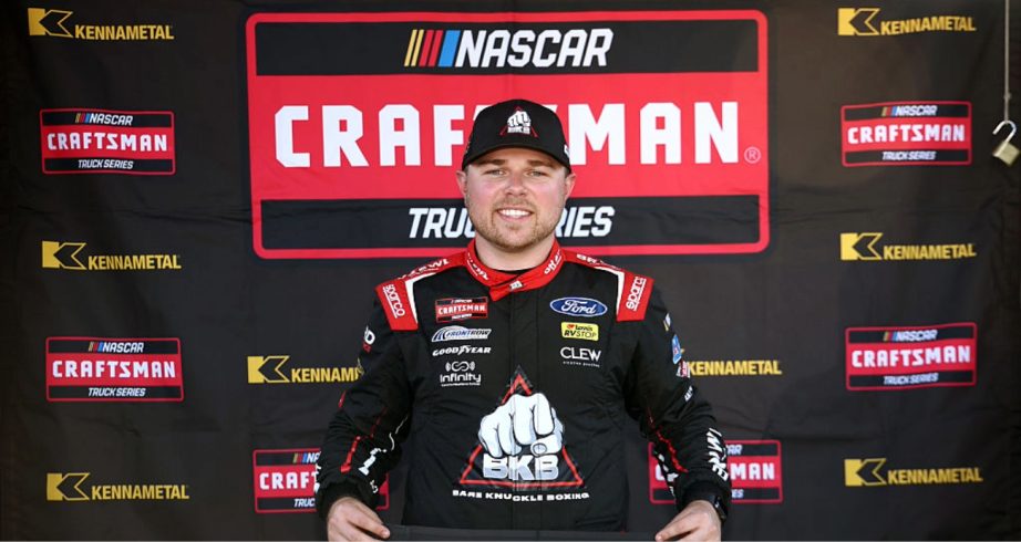 Layne Riggs celebrates after winning the pole at Martinsville.