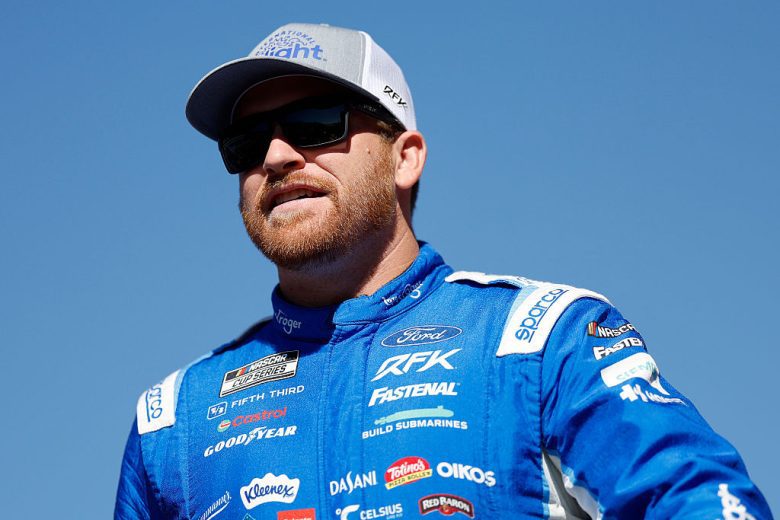 Chris Buescher looks on.