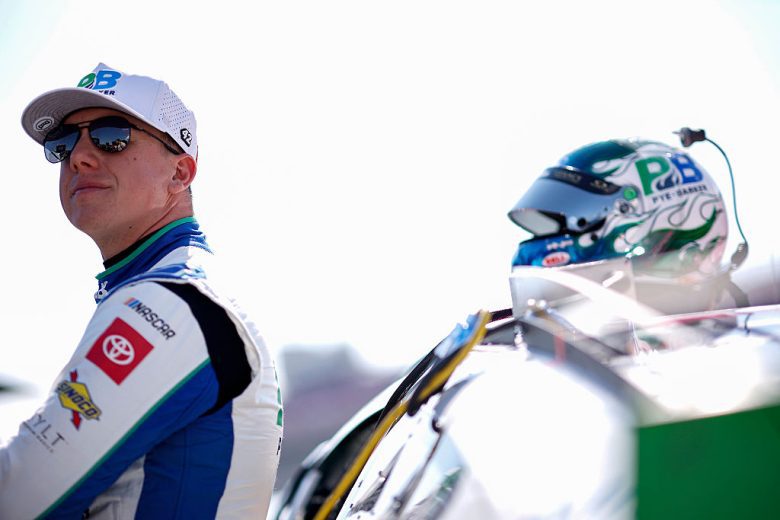 John Hunter Nemechek looks on.