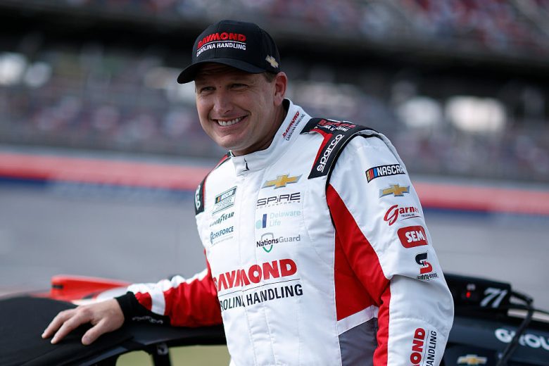 Michael McDowell looks on.