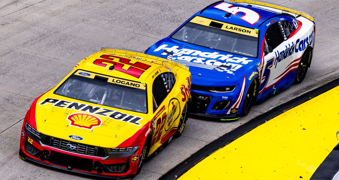 Joey Logano and Kyle Larson race at Martinsville.