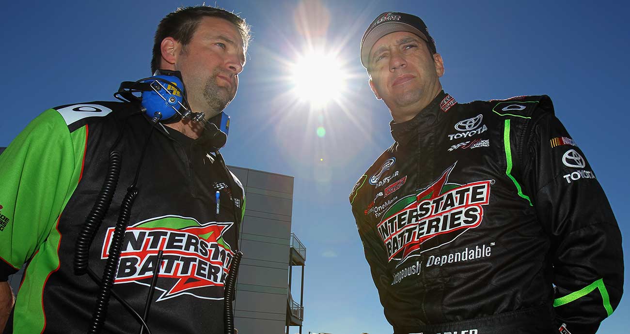 Crew chief Chris Gayle talks with Elliott Sadler in the garage at Las Vegas Motor Speedway