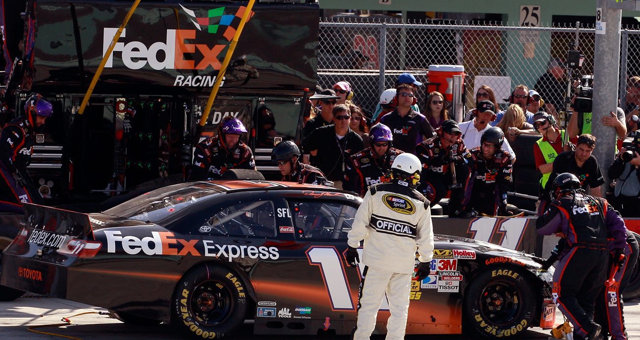 Denny Hamlin makes a pit stop after sustaining front end damage during the NASCAR Cup Series Ford 400 at Homestead-Miami Speedway on Nov. 21, 2010 in Homestead, Florida.