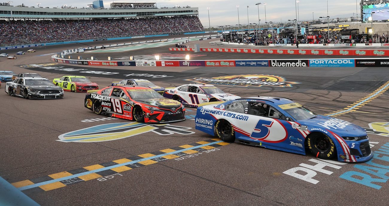 Kyle Larson, Martin Truex Jr. and Denny Hamlin race during the NASCAR Cup Series Championship at Phoenix Raceway on Nov. 7, 2021 in Avondale, Arizona.