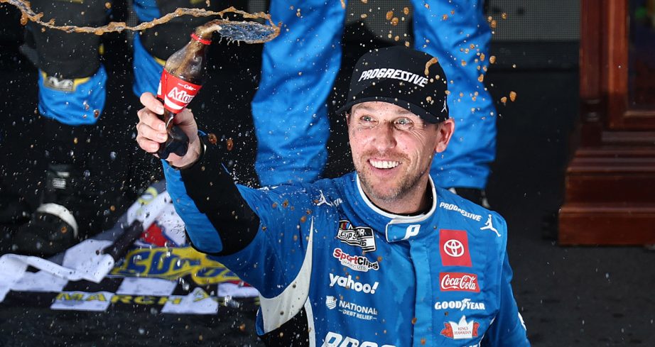 Denny Hamlin celebrates a NASCAR Cup Series win.