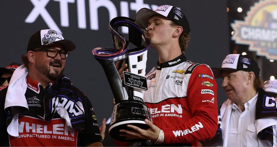 Jesse Love kisses the championship trophy at Phoenix.