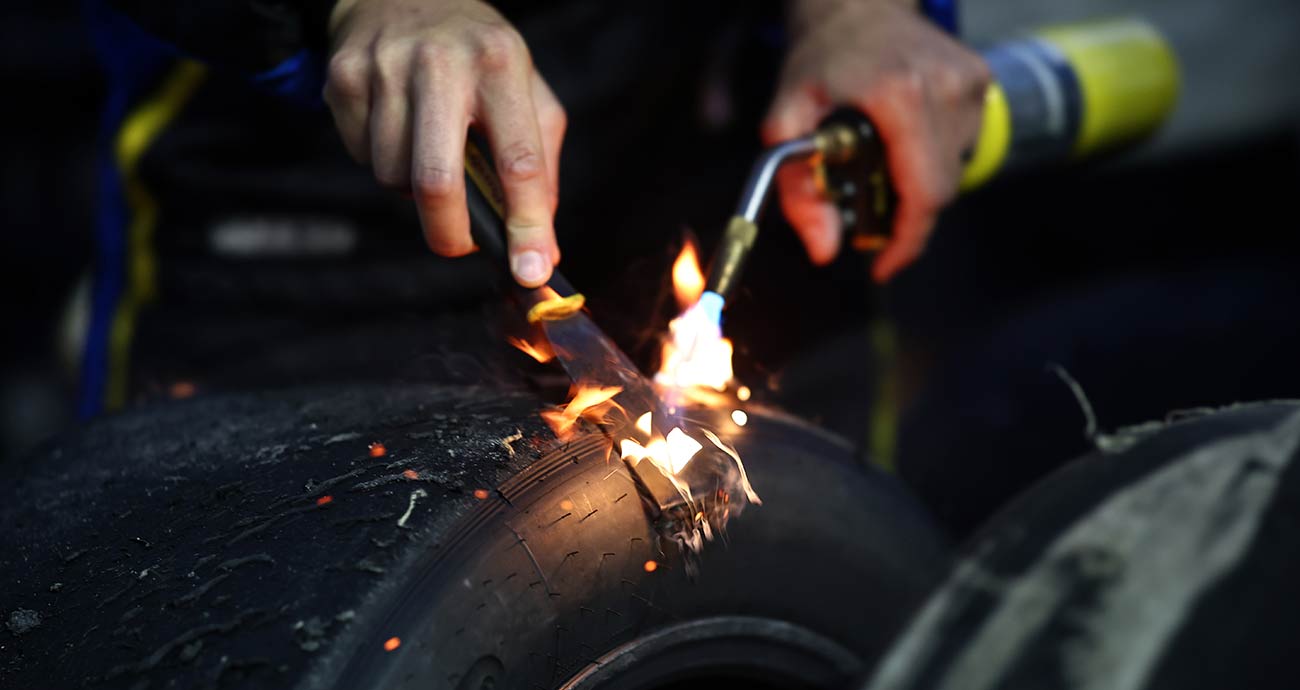 A Spire Motorsports tire technician checks for wear at Bristol Motor Speedway