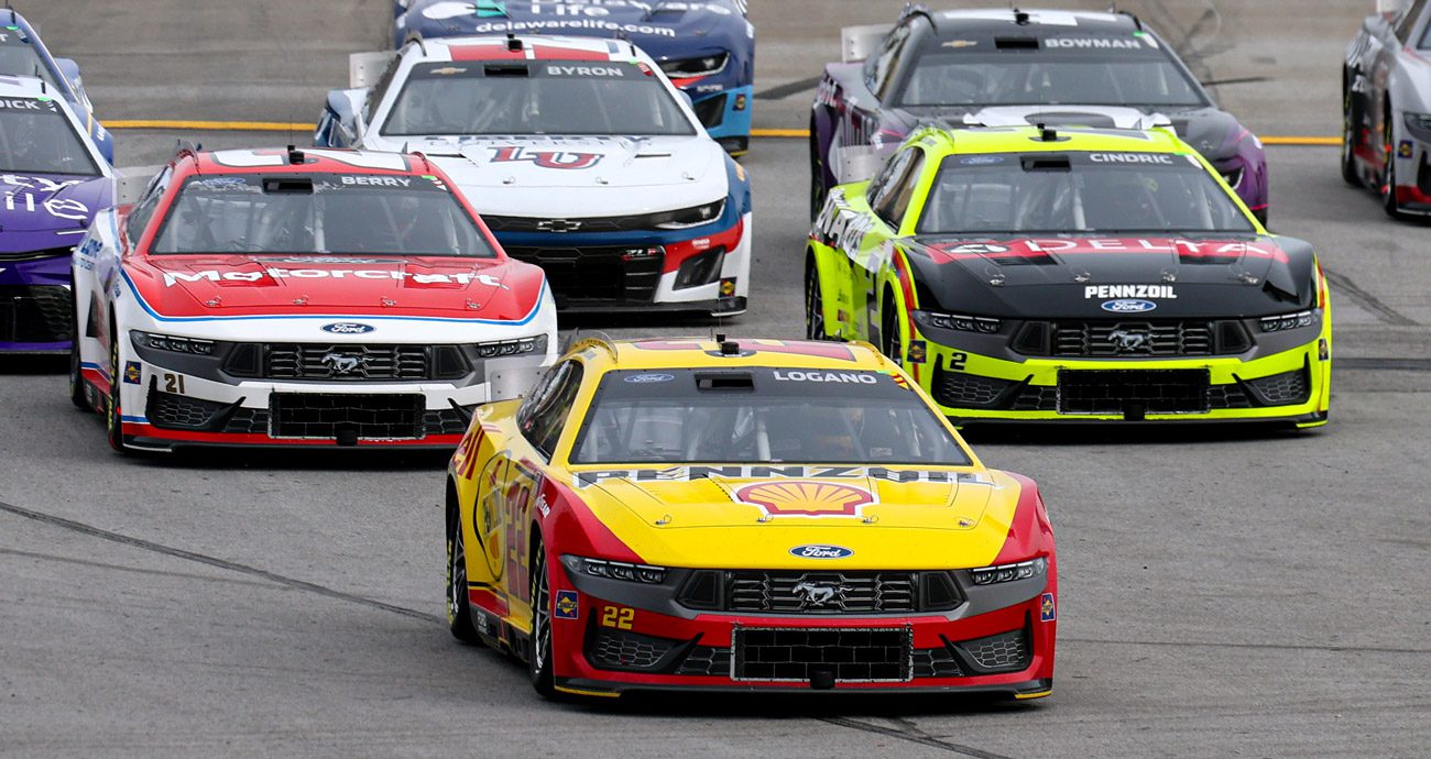 Joey Logano, Josh Berry and Austin Cindric drive off pit road.