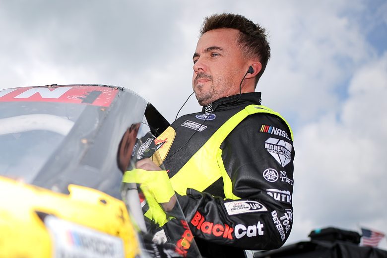 Frankie Muniz enters his race truck.