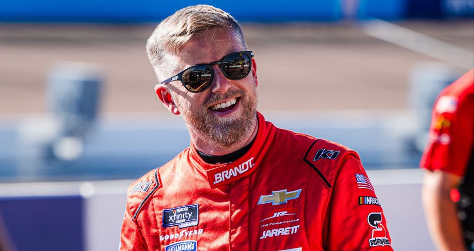 Justin Allgaier smiles and looks on.