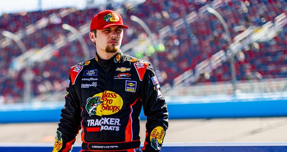 Carson Kvapil looks on.