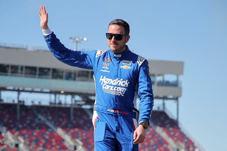 Alex Bowman waves to fans.