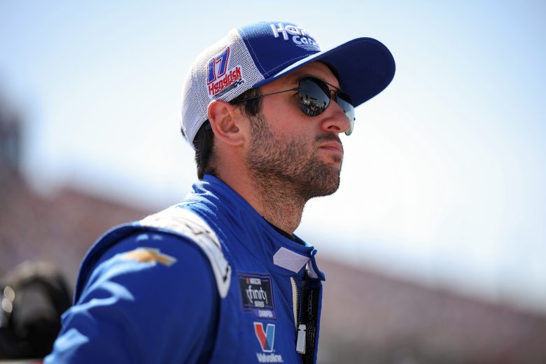 Chase Elliott looks on.