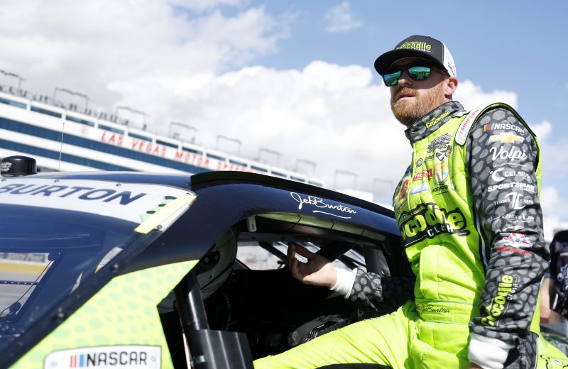 Jeb Burton climbs into race car.