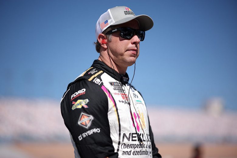 Brad Keselowski looks on.