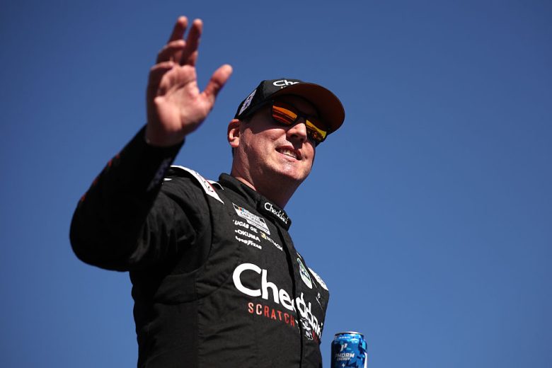 Kyle Busch waves to the crowd.