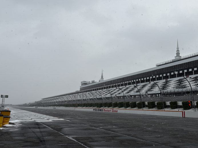 A view of the frontstretch at Pocono Raceway as snow falls.
