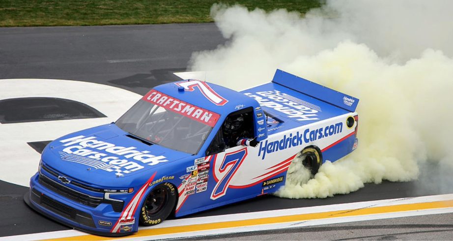 Kyle Busch celebrates with a burnout after winning at EchoPark Speedway.