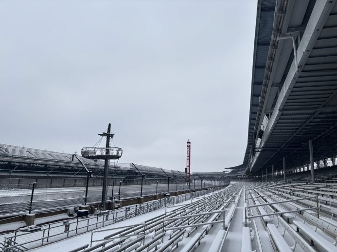 A blanket of snow covers the Indianapolis Motor Speedway, with a view toward the track's Turn 1
