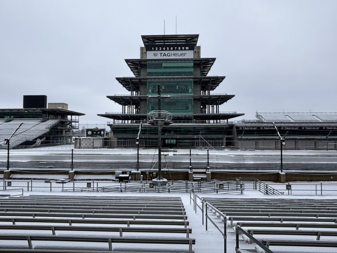 A blanket of snow covers the Indianapolis Motor Speedway, with its iconic pagoda overseeing the frontstretch