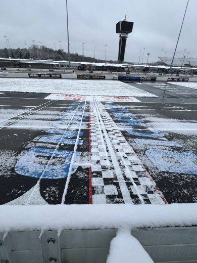 A view of the Richmond Raceway start/finish line with snow.