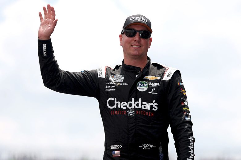 Kyle Busch waves to fans.