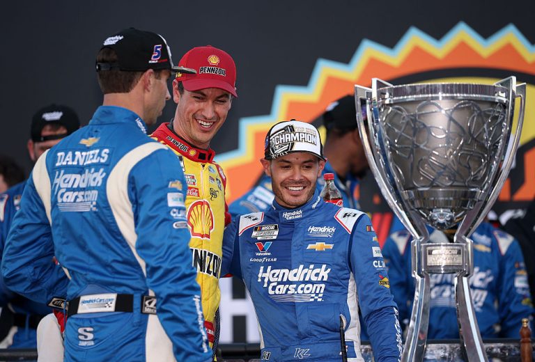 Joey Logano chats with Cliff Daniels and Kyle Larson.