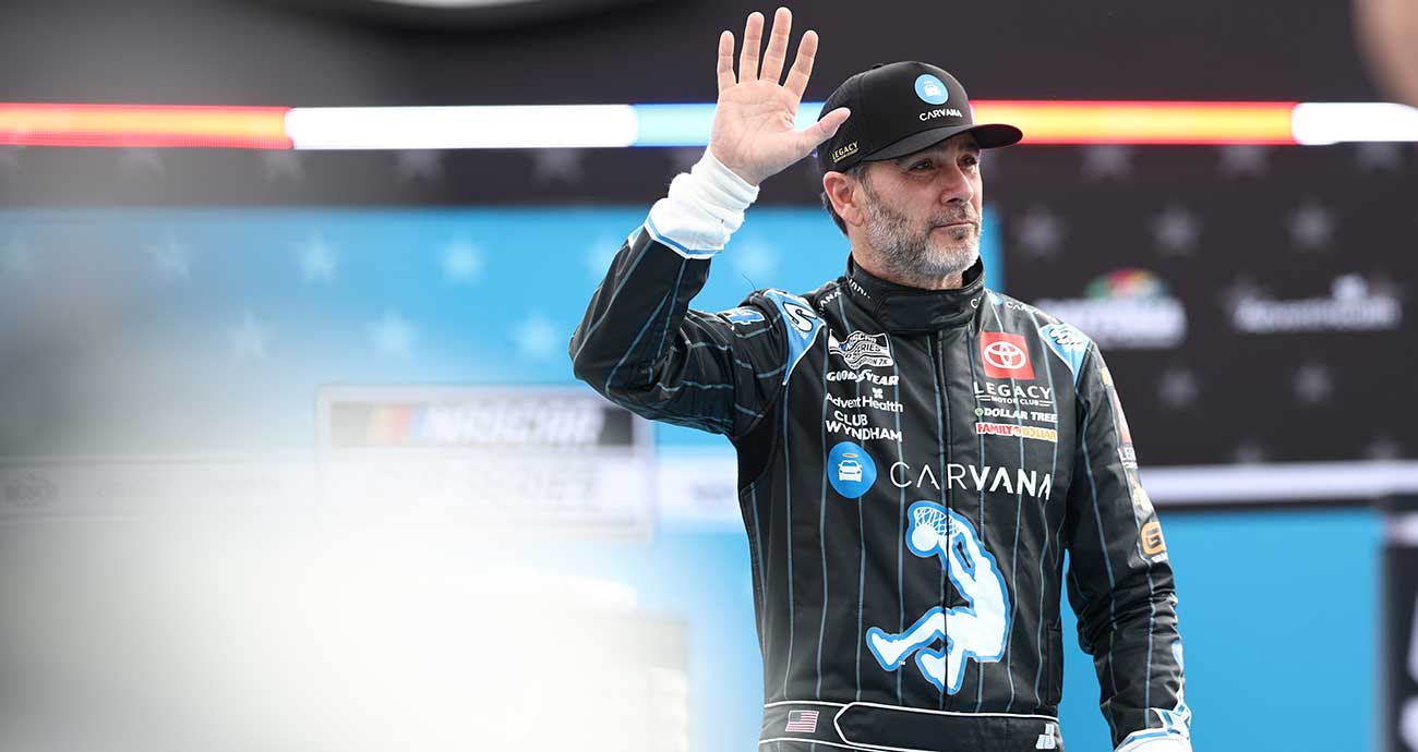 Jimmie Johnson waves to the crowd during driver introductions at the 2025 Daytona 500