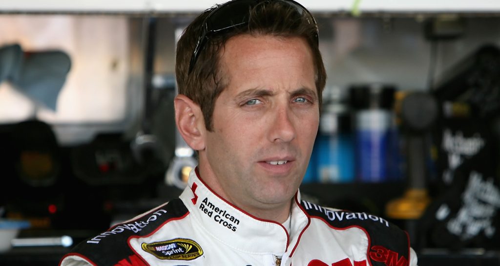 Greg Biffle, driver of the No. 16 3M/Red Cross Ford, stands in the garage during practice for the NASCAR Cup Series Checker O