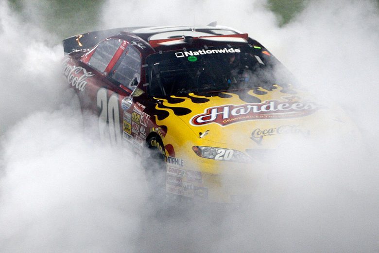 Denny Hamlin does a victory burnout in the No. 20 Toyota.