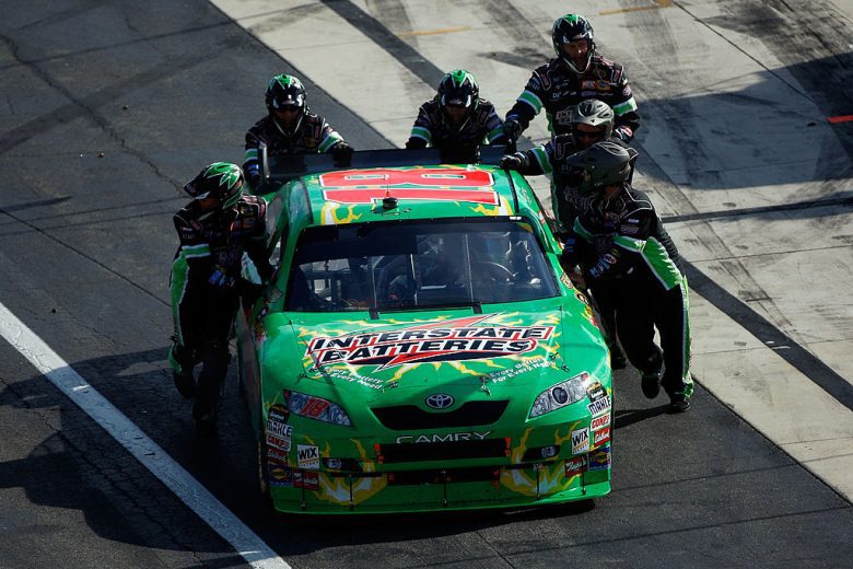 Kyle Busch's No. 18 Toyota is pushed to the garage.