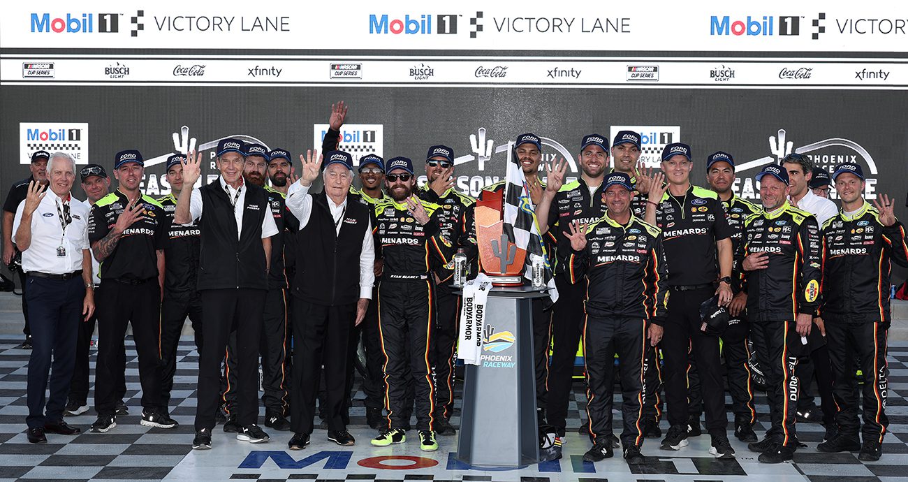AVONDALE, ARIZONA - NOVEMBER 02: Ryan Blaney, driver of the #12 Menards/Dutch Boy Ford, Roger Penske, owner of the Penske Motorsports and crew celebrate in victory lane after winning the NASCAR Cup Series Championship race at Phoenix Raceway on November 02, 2025 in Avondale, Arizona. (