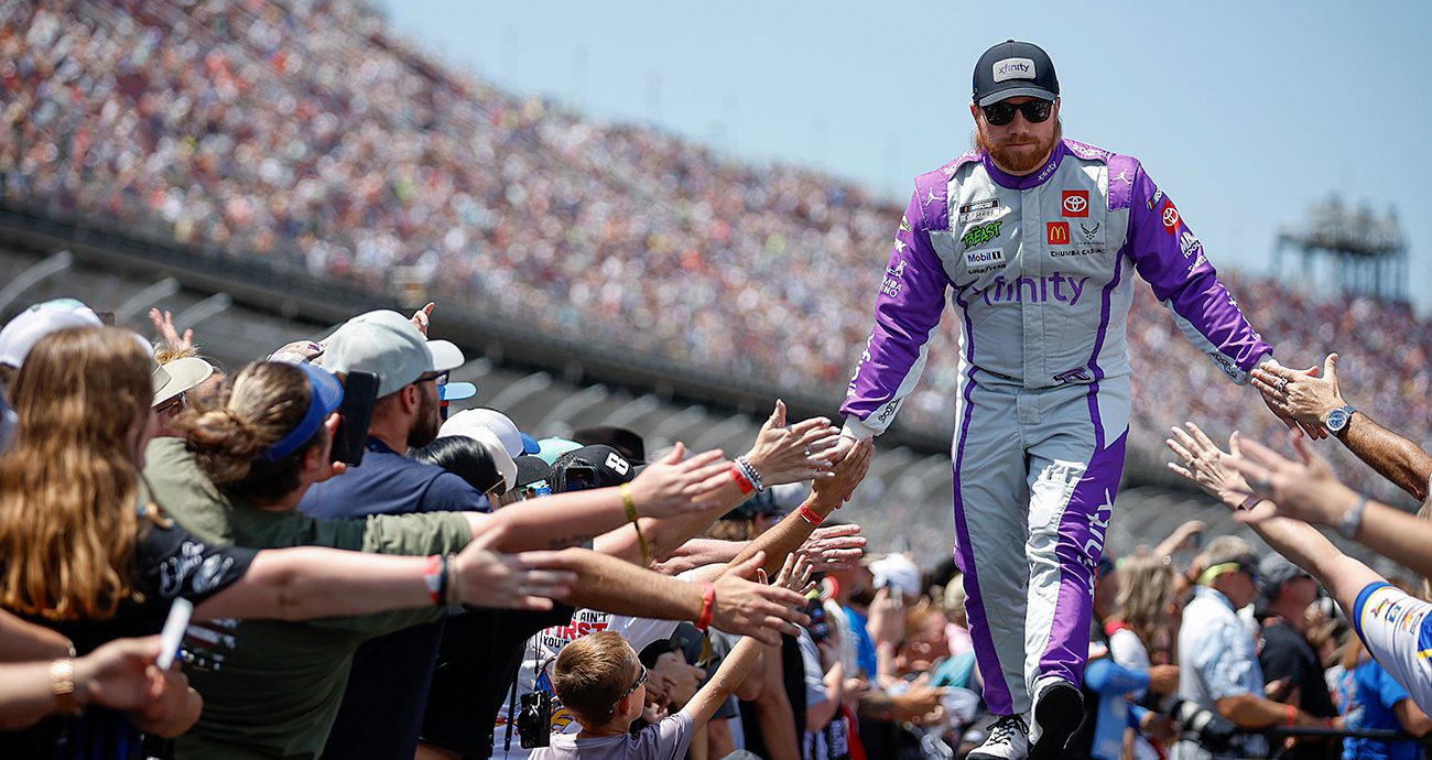 TALLADEGA, ALABAMA - APRIL 27: Tyler Reddick, driver of the #45 Xfinity Mobile Toyota, greets fans as he walks onstage during driver intros prior to the NASCAR Cup Series Jack Link's 500 at Talladega Superspeedway on April 27, 2025 in Talladega, Alabama.
