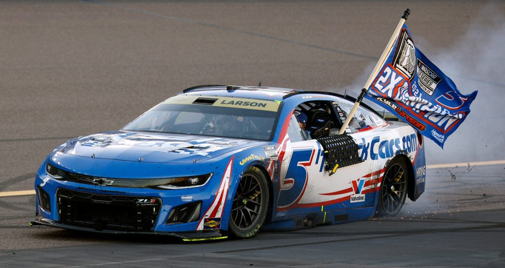 Kyle Larson, driver of the No. 5 HendrickCars.com Chevrolet, celebrates with a burnout after finishing first of the NASCAR Cup Series Championship 4 drivers to win the NASCAR Cup Series Championship at Phoenix Raceway on Nov. 2, 2025 in Avondale, Arizona.