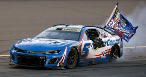 Kyle Larson, driver of the No. 5 HendrickCars.com Chevrolet, celebrates with a burnout after finishing first of the NASCAR Cup Series Championship 4 drivers to win the NASCAR Cup Series Championship at Phoenix Raceway on Nov. 2, 2025 in Avondale, Arizona.